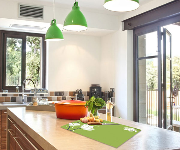 Personalized glass cutting board on kitchen island